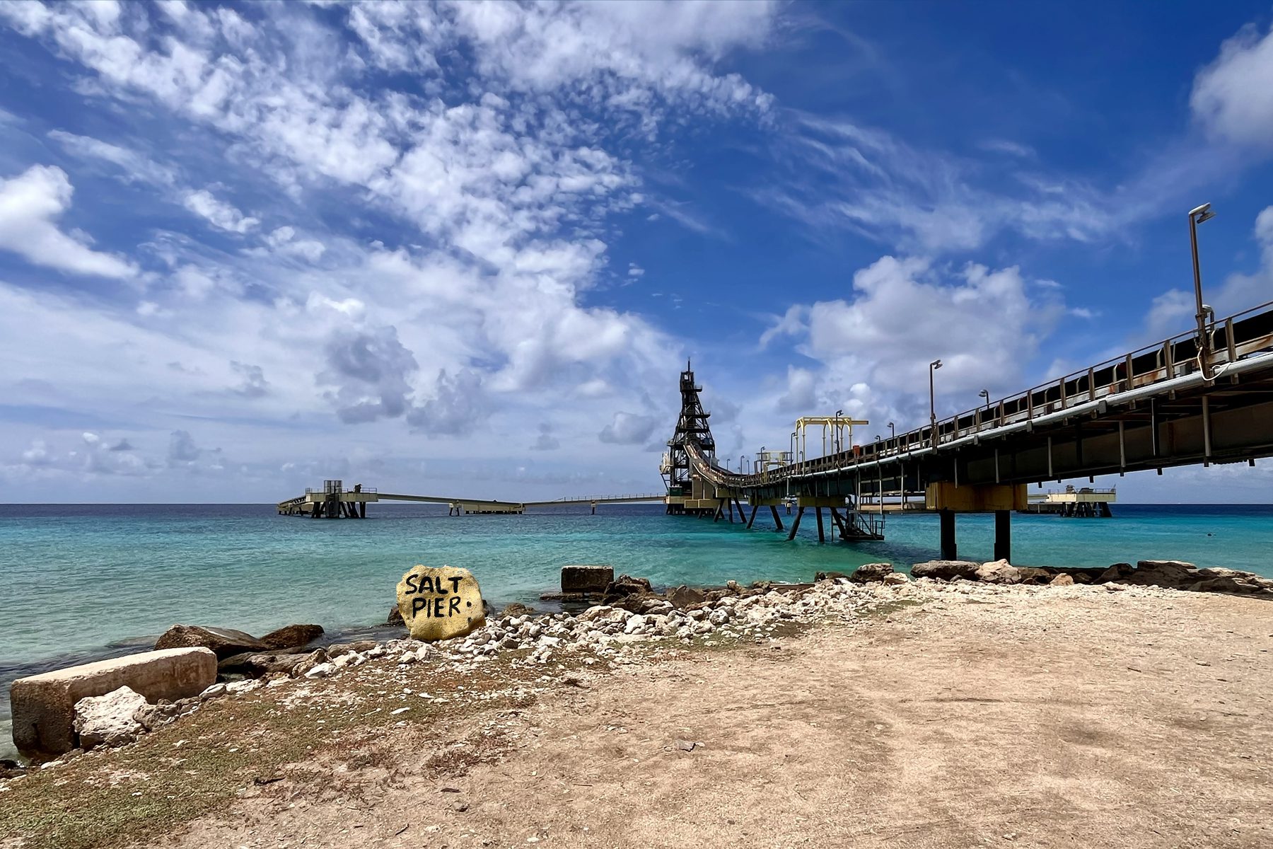 Yellow Salt Pier stone near the coast and salt pier on Bonaire